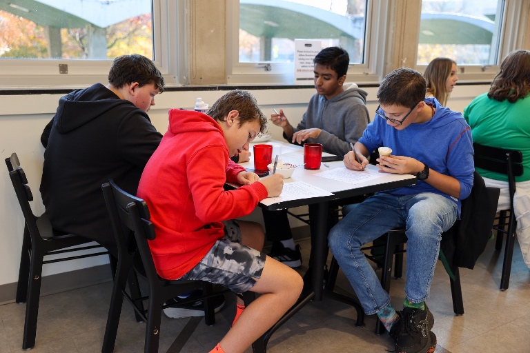 Students fill out a survey before completing their lunch